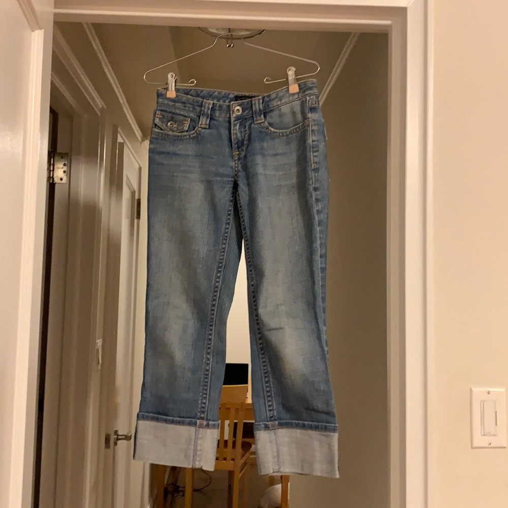 Jeans.  Mid-rise, distressed boyfriend jeans